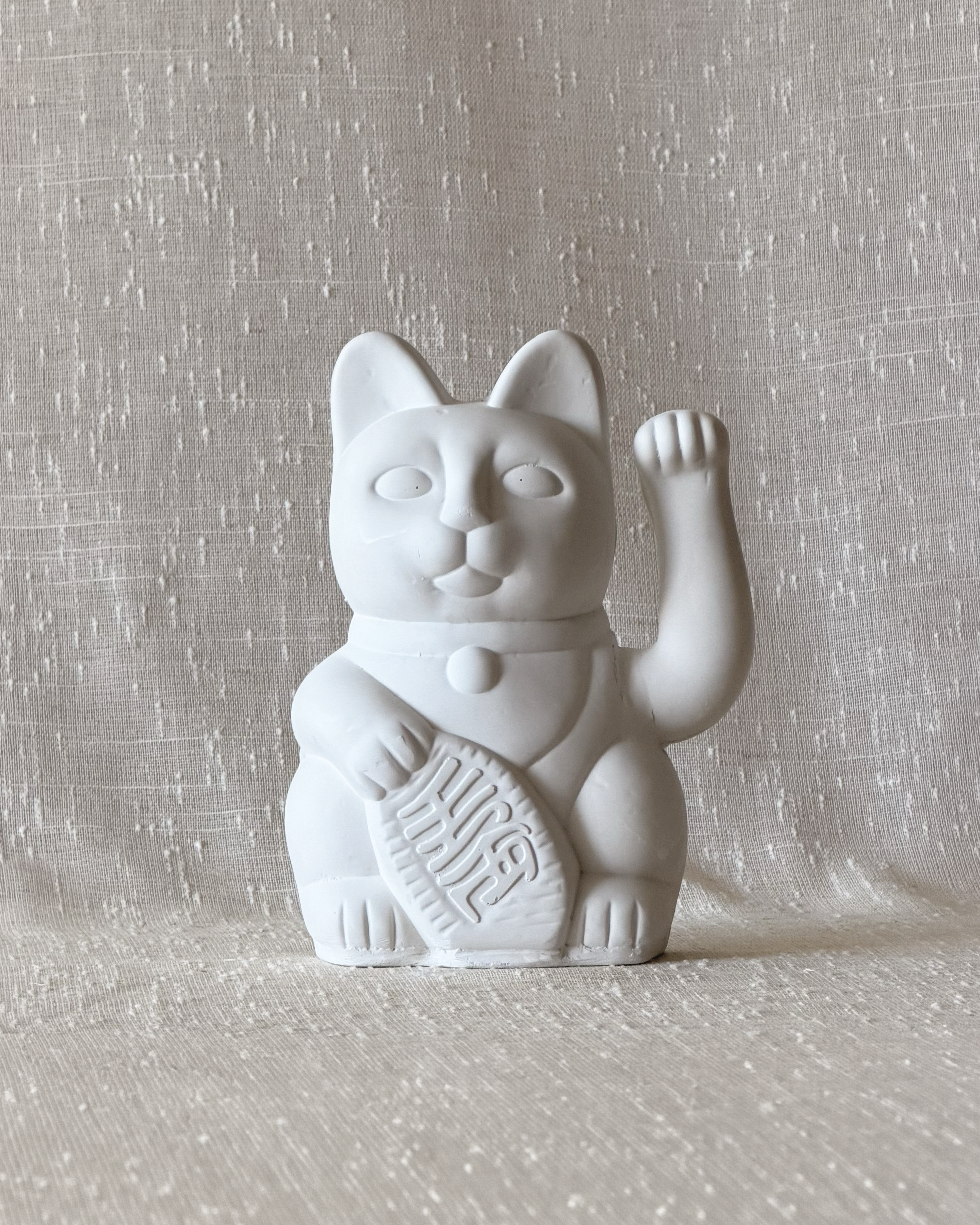 gato de piedra pared