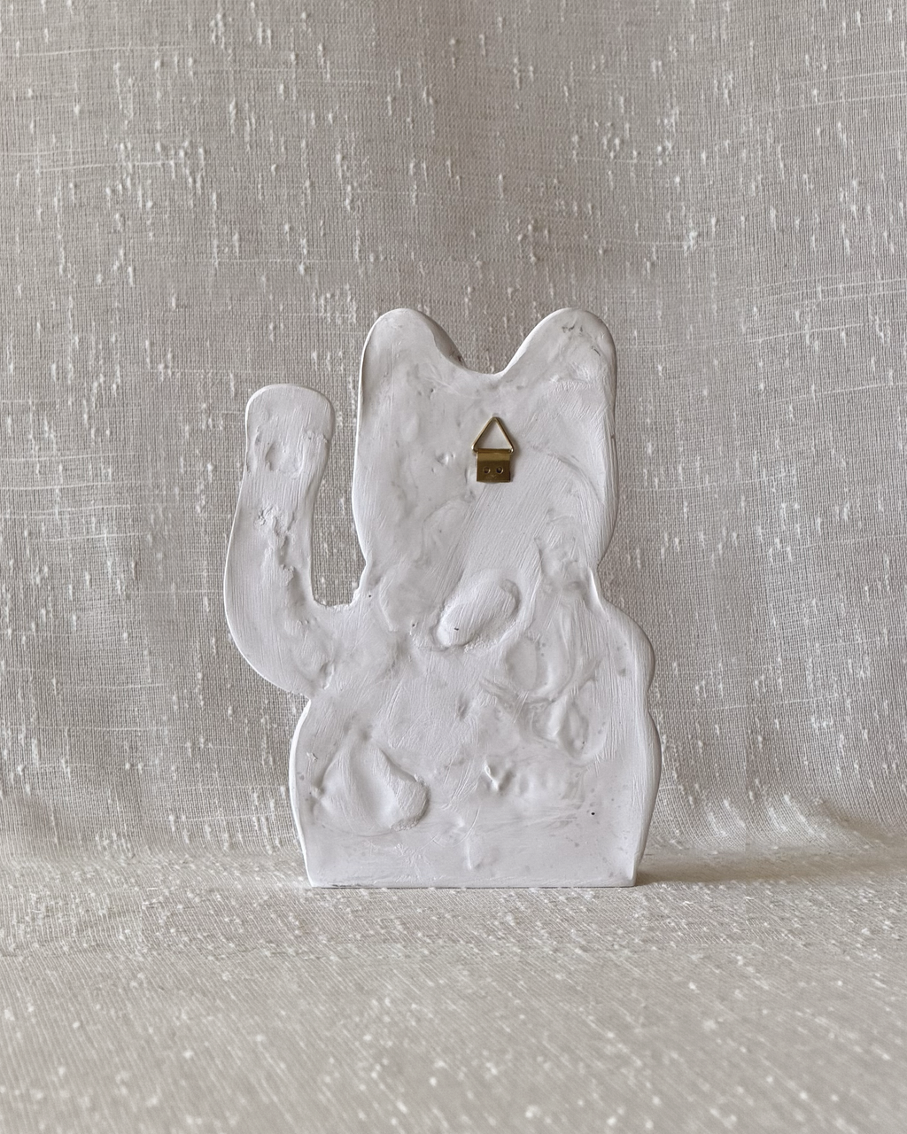 gato de piedra pared