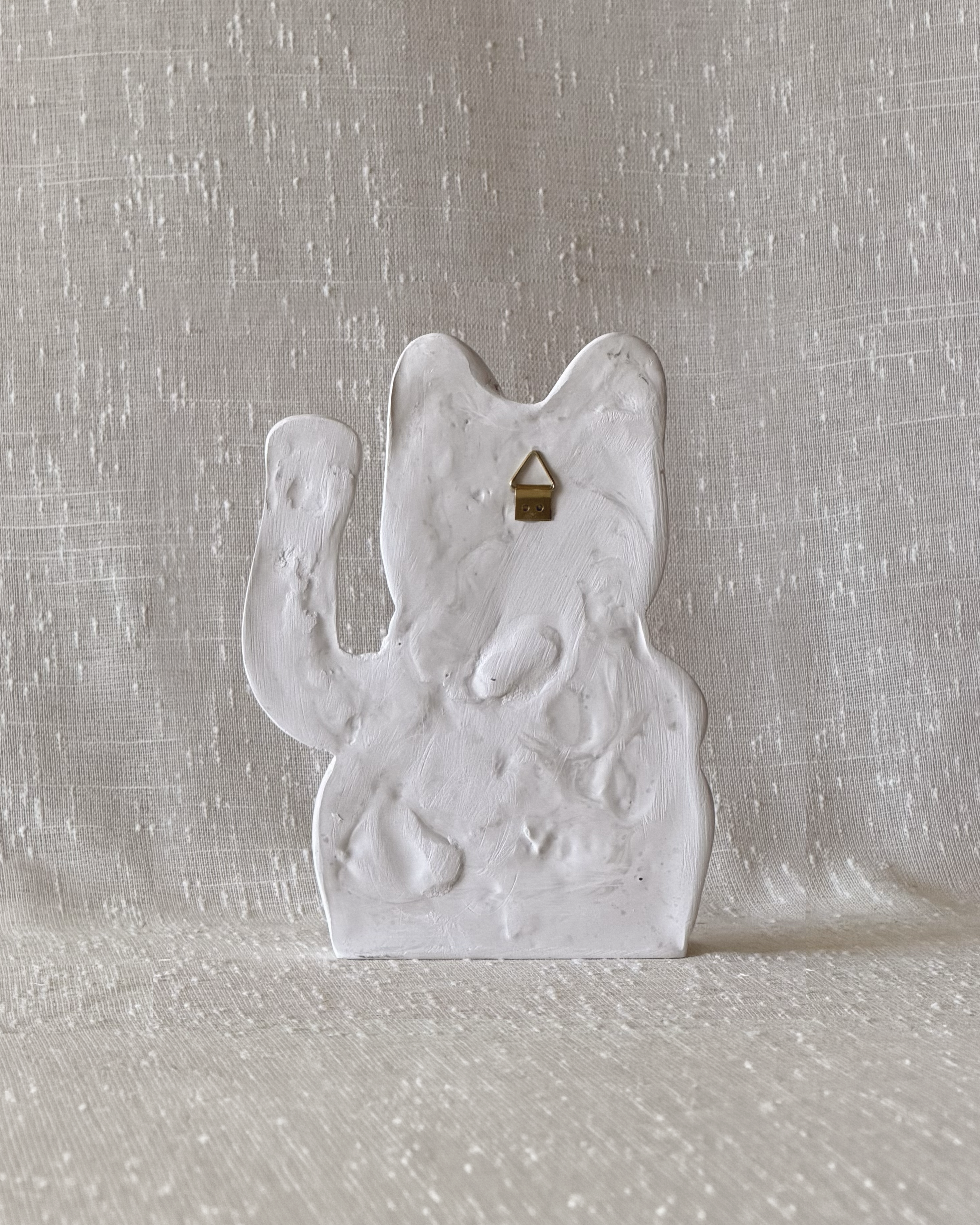 gato de piedra pared